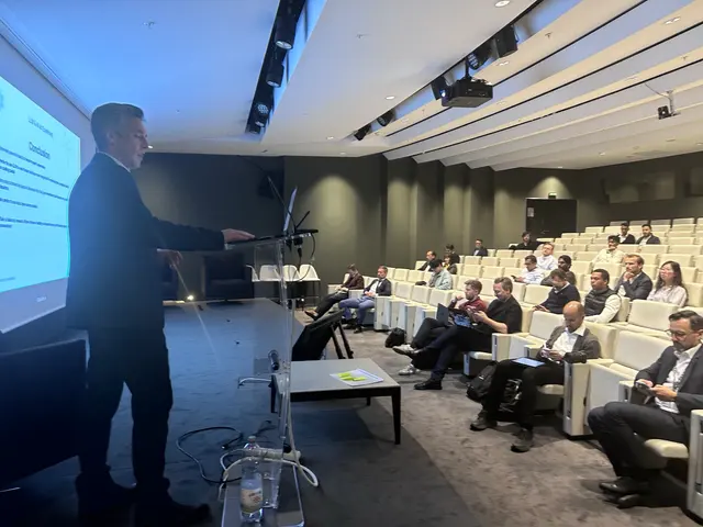 Speaker with audience at AI in Finance Paris
